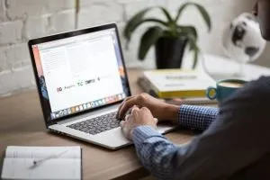 a person using laptop to find out more about resource page link building
