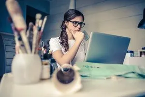 A woman doing research on laptop
