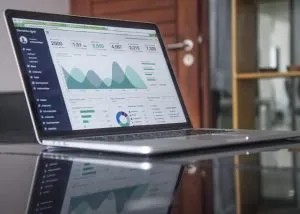 A laptop showing graphs