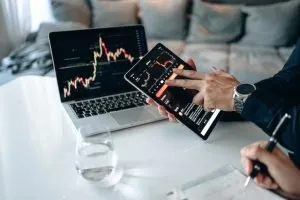 Person looking at graphs of Internet Usage Statistics and Latest Trends for 2022