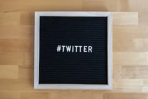 Written twitter on black background