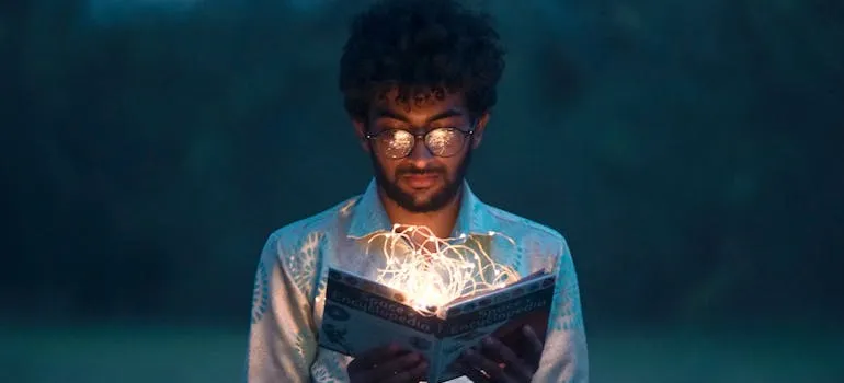man reading a book of secret knowledge