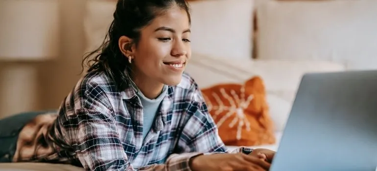 woman reading on a laptop