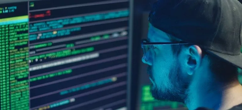 man writing code