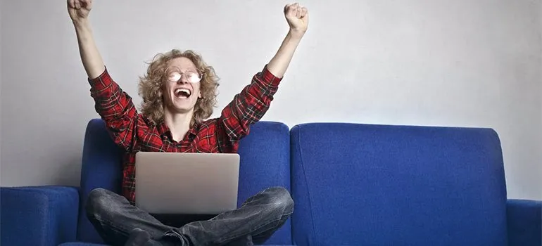 happy man using laptop